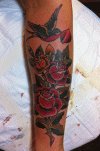 mark-lonsdale-tattoo-bondi-sydney-swallow-and-roses